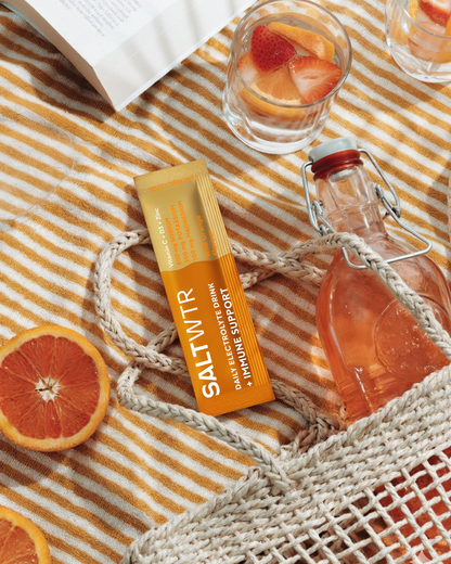 SaltWTR Wild Orange Immune Support SaltWTR bottle with vibrant orange label and citrus imagery for immune health.