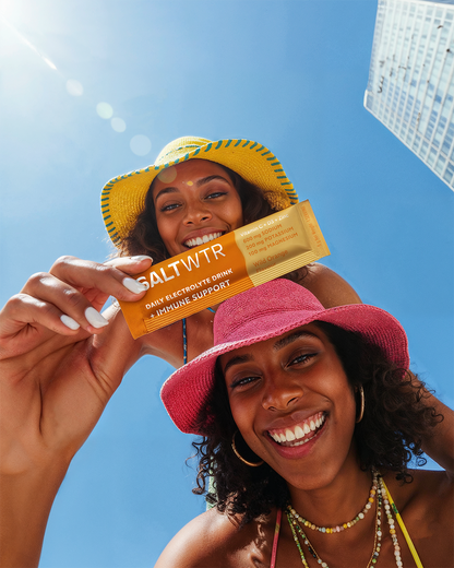 SaltWTR Wild Orange immune support saltwater product with vibrant orange flavor packaging and natural ingredient imagery.