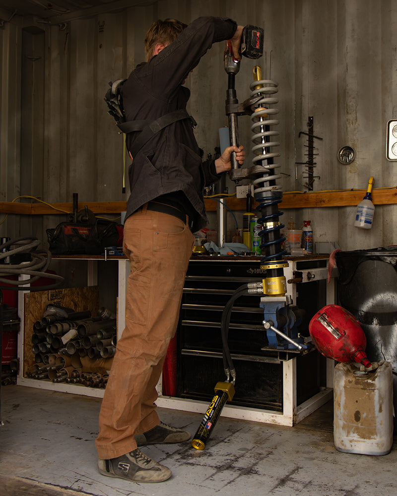 Off The Grid Surplus Trailblazer standard fit pants in durable fabric, shown in a natural outdoor setting.