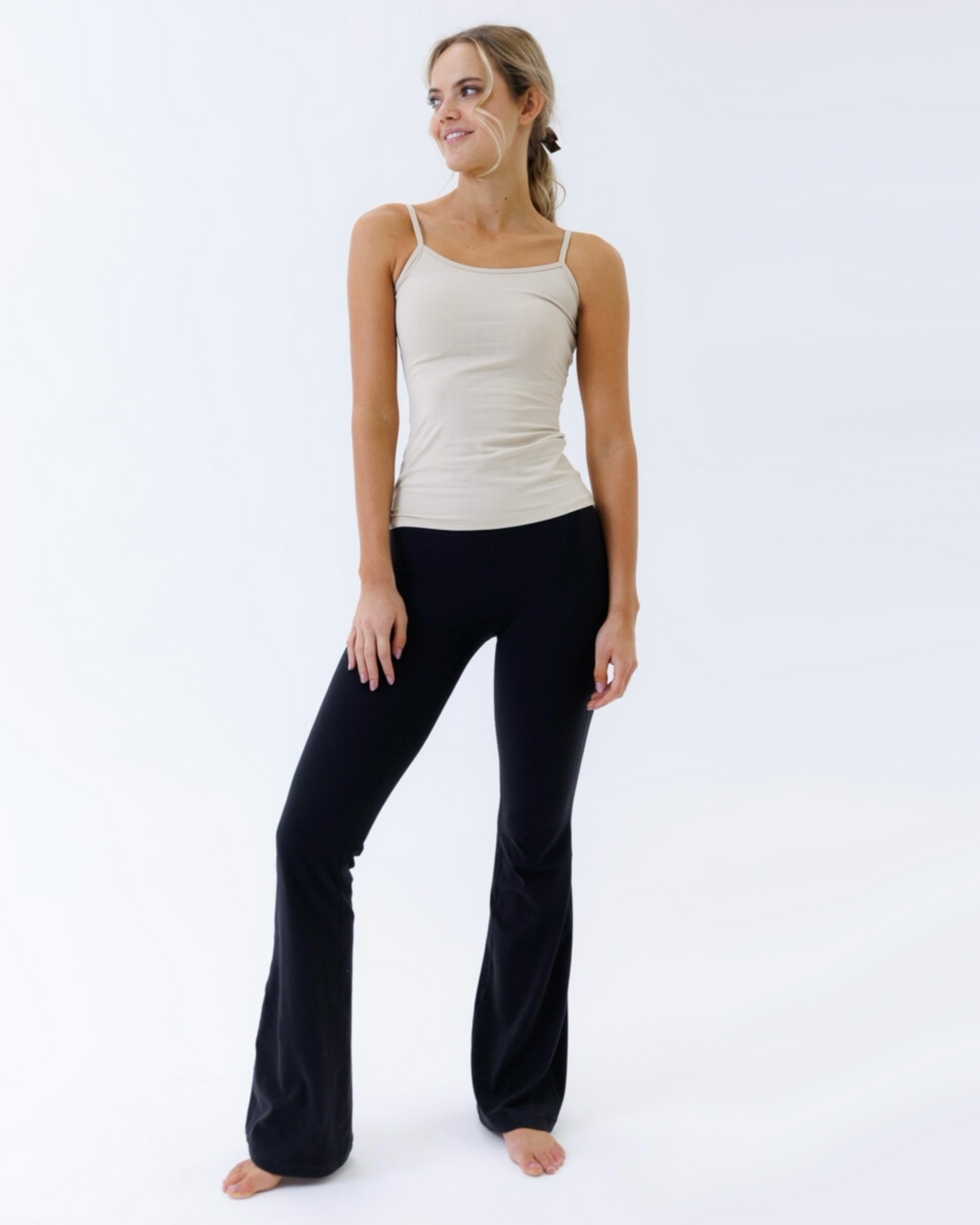 Downeast Wonder Cami nude-colored tee shirt displayed flat, showcasing its soft fabric and simple, versatile design.