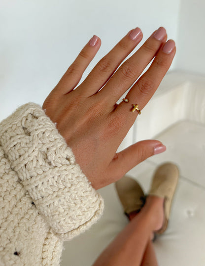 Elevated Faith wrapped cross gem ring featuring a silver band and sparkling gemstone accent, stylish religious jewelry accessory.