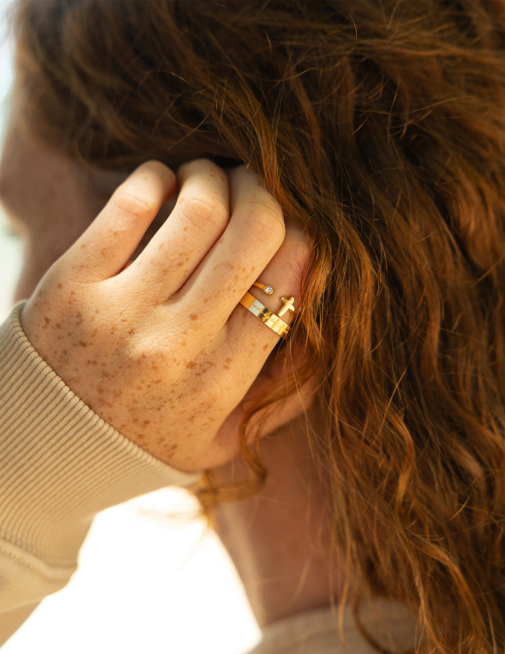 Elevated Faith Wrapped Cross Gem Ring featuring a detailed cross design with sparkling gemstone accents on a silver band.