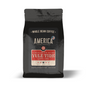 Whole coffee beans from America Supply Company LLC with Yule Tide candy cane flavor, naturally flavored for festive taste.