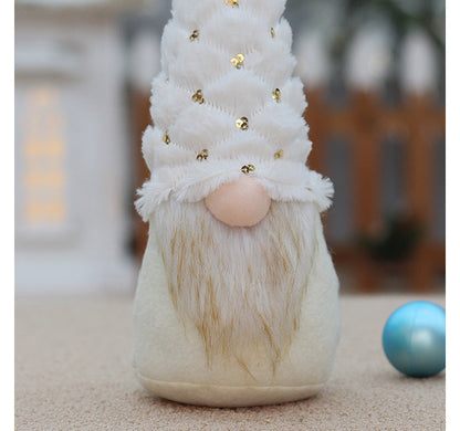 Faceless doll Christmas decorations in festive holiday attire