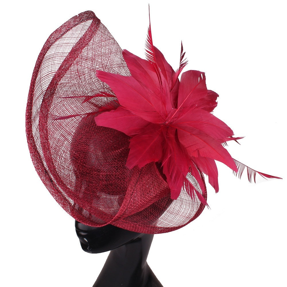 Fan-shaped handcrafted linen headpiece in natural fabric with textured pleats and a decorative, sculptural design