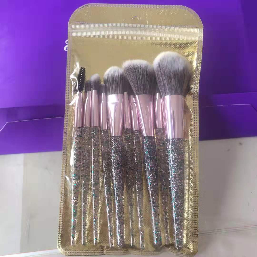 10-piece essential makeup brush kit by BACKUPMYFILESNOW® featuring various brushes with black handles and soft bristles for makeup application