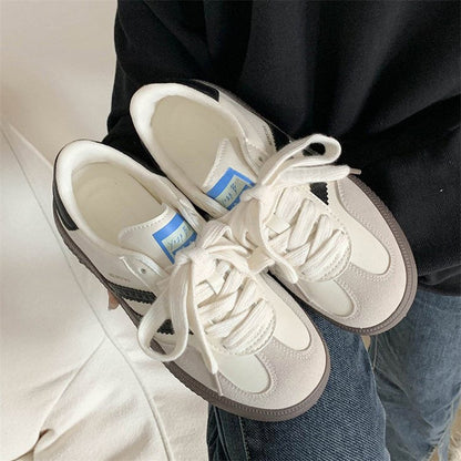 Retro casual white sneakers for women, versatile sports footwear with a clean low-top design