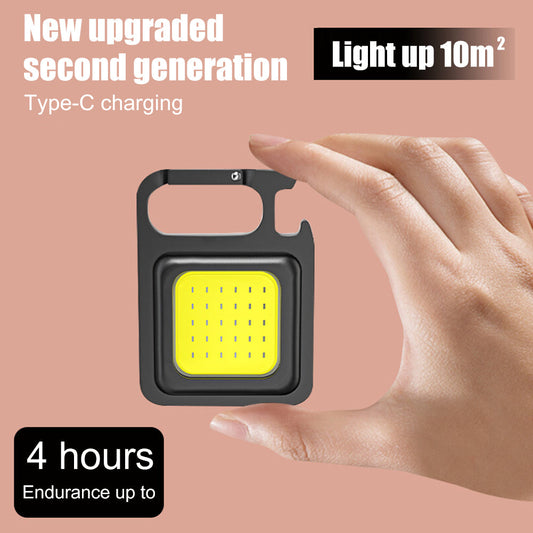 Mini portable rechargeable COB LED keychain flashlight with USB charging for camping and emergency use