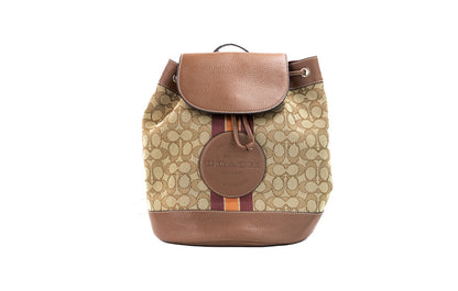 Coach Dempsey Khaki Saddle Signature Jacquard Canvas Patch Backpack with adjustable straps and multiple compartments.