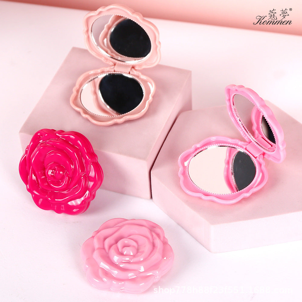 Portable folding mirror with electroplated rose design in a compact case