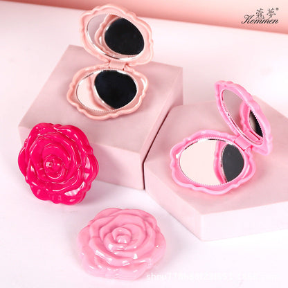 Portable folding mirror with electroplated rose design in a compact case