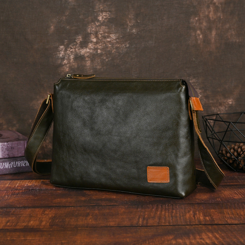 Men's large-capacity leather shoulder bag in a structured design with an adjustable strap