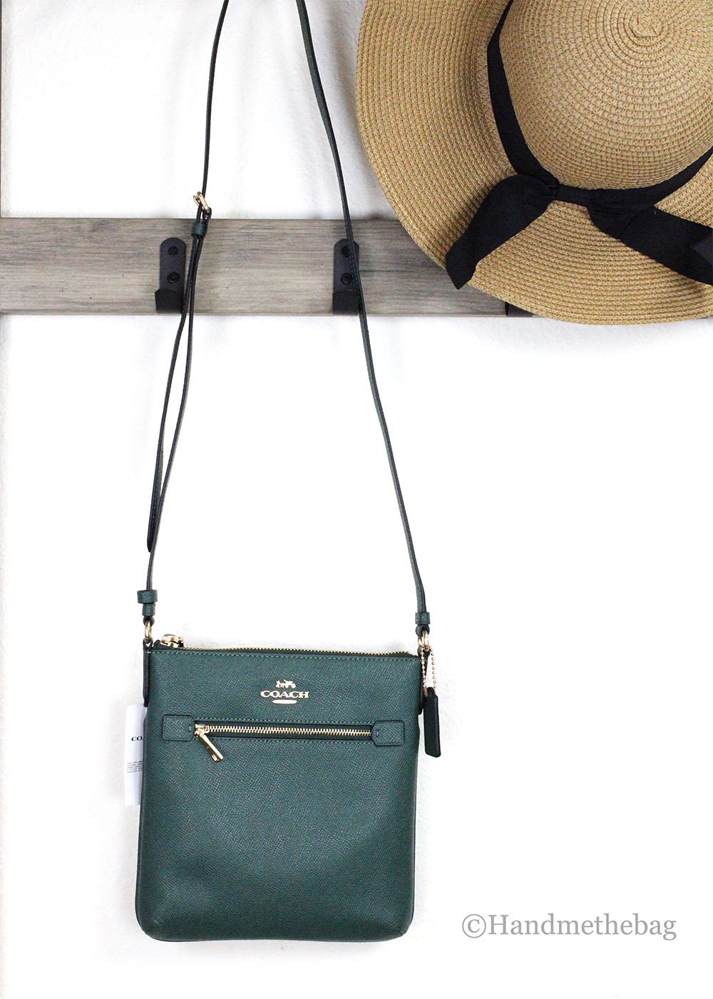 Coach Rowan Mini Dark Pine leather crossbody bag with file compartment, compact and stylish for everyday use.