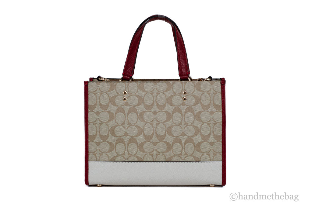 Coach Dempsey Medium Lunar New Year Rabbit Carryall Tote in colorful fabric with rabbit design and leather handles.