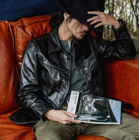 Men's mid-length heavy-duty leather jacket in durable black leather with a structured fit