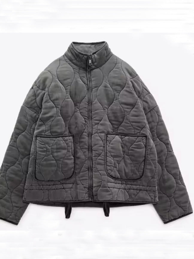 Women's diamond-quilted cotton jacket in a neutral tone, front view