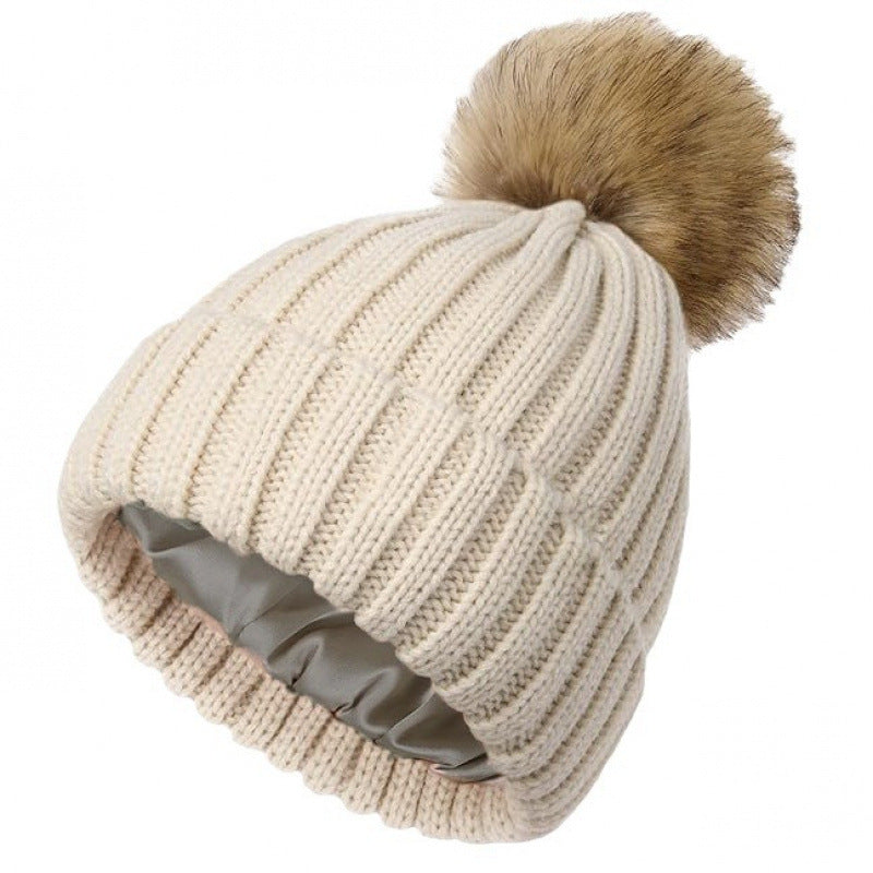Women's solid-color brimmed hat with satin pom-pom, front view