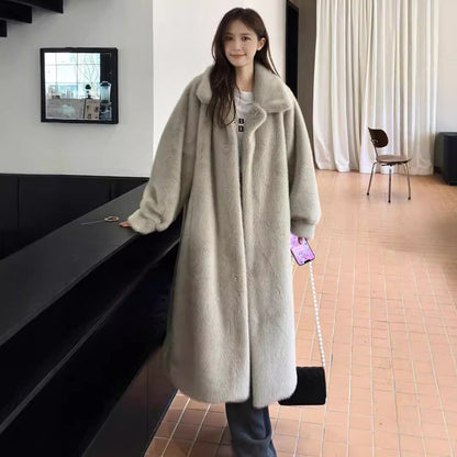 Women's winter extended fashion leather fur coat with plush fur trim and long silhouette