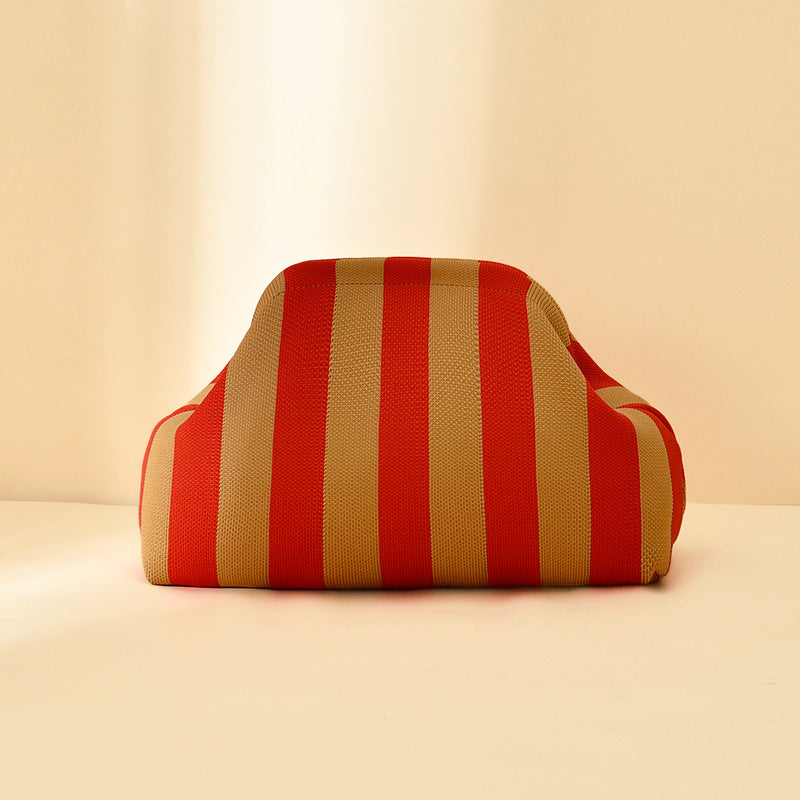 Women's knitted striped clutch bag in a compact woven design