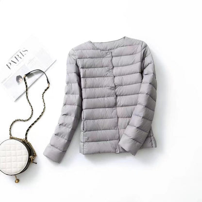 Women's lightweight white duck down jacket displayed on a model