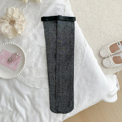 Women's cotton calf-length socks with silver-thread bow.