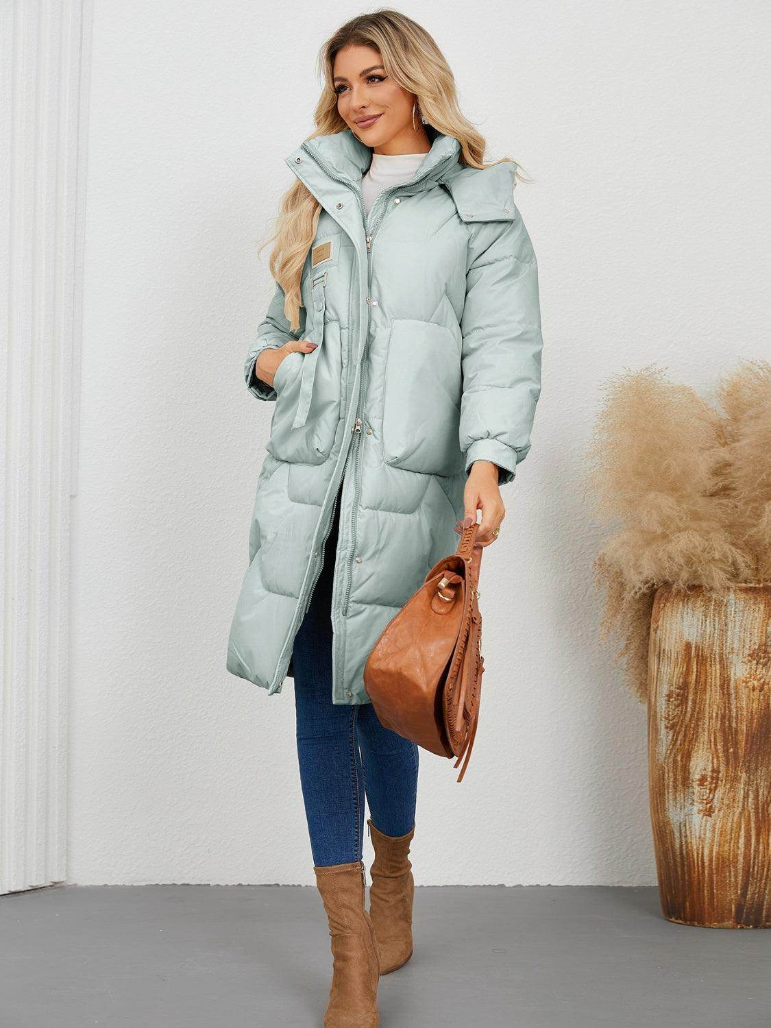Long sleeve longline hooded winter coat for women by Trendsi, featuring a warm, stylish design with a comfortable fit.