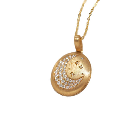 Open-and-close album pendant moon and star necklace with detailed celestial design