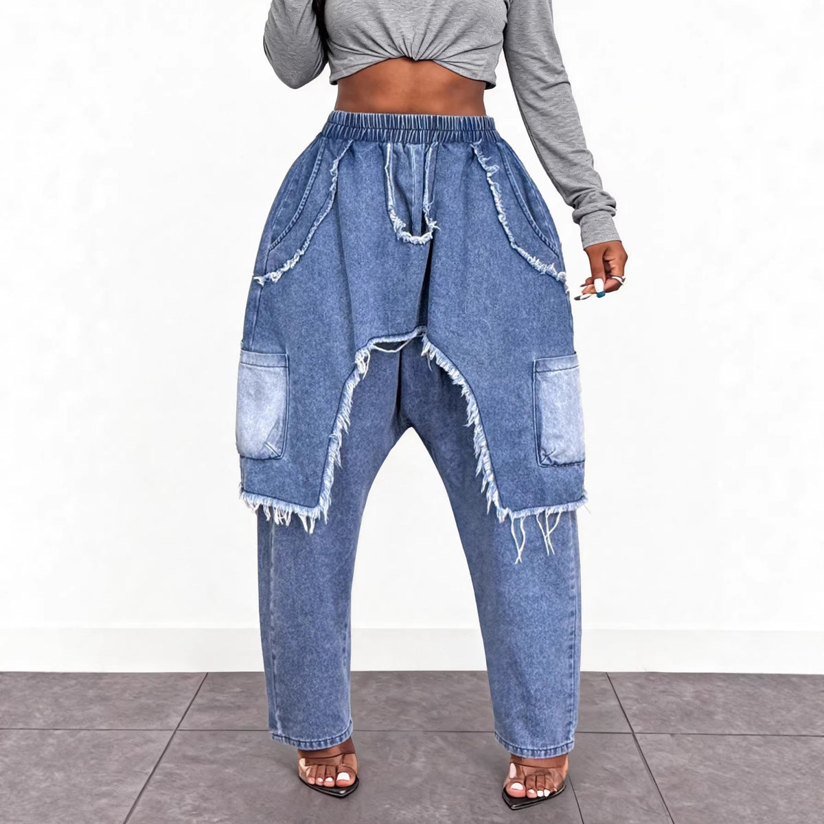 Personalized distressed brushed ripped jeans with trendy faded detailing and visible knee tears
