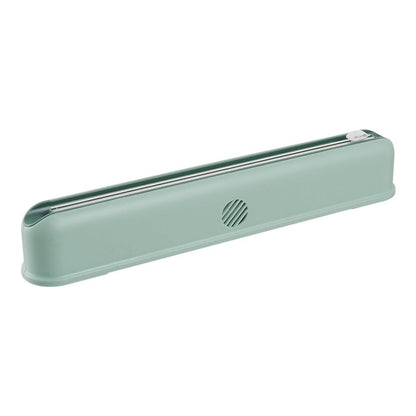 Wall-mounted cling film box with suction cup and adjustable cutter for kitchen storage