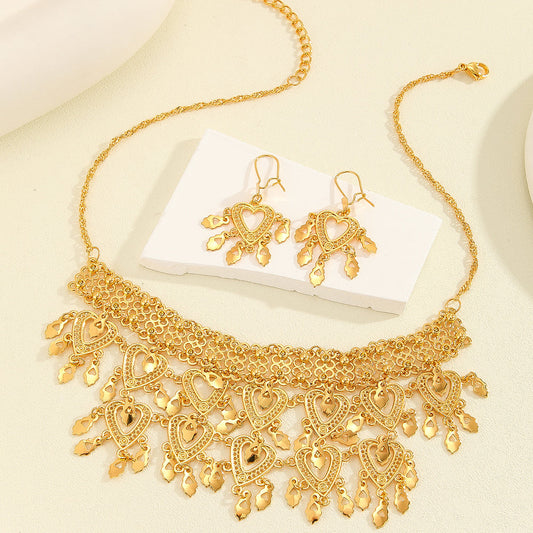 Retro heart-shaped hollow necklace and earrings jewelry set for women, featuring a fashionable design for party or daily wear