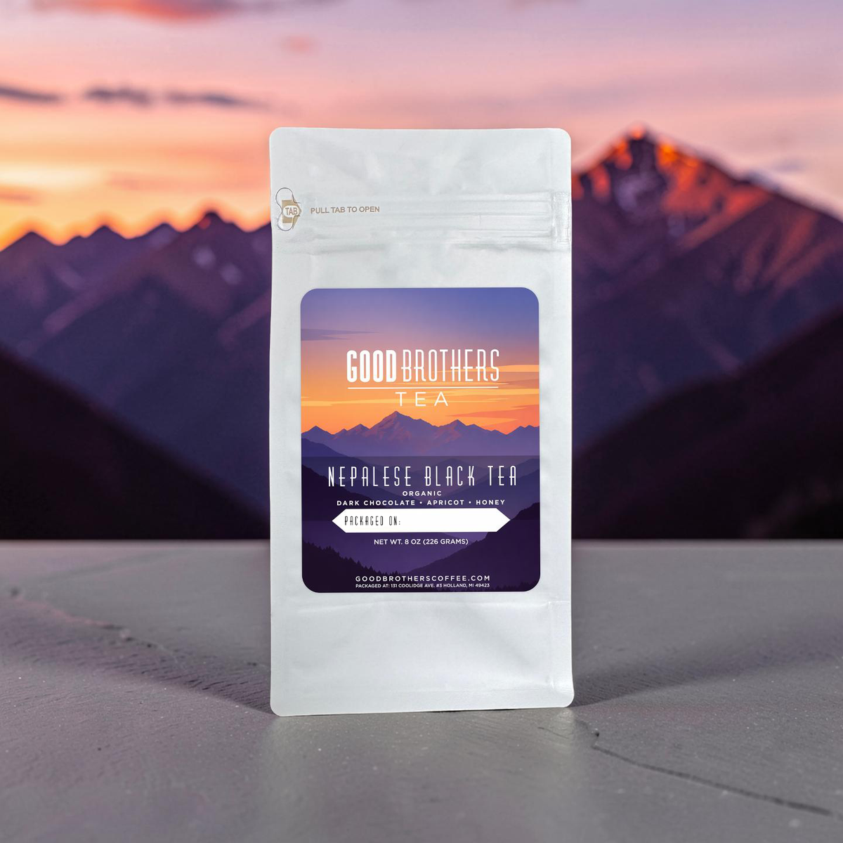 Loose leaf Organic Nepalese Black Tea by Good Brothers Coffee LLC, showing dark tea leaves in a clear container.