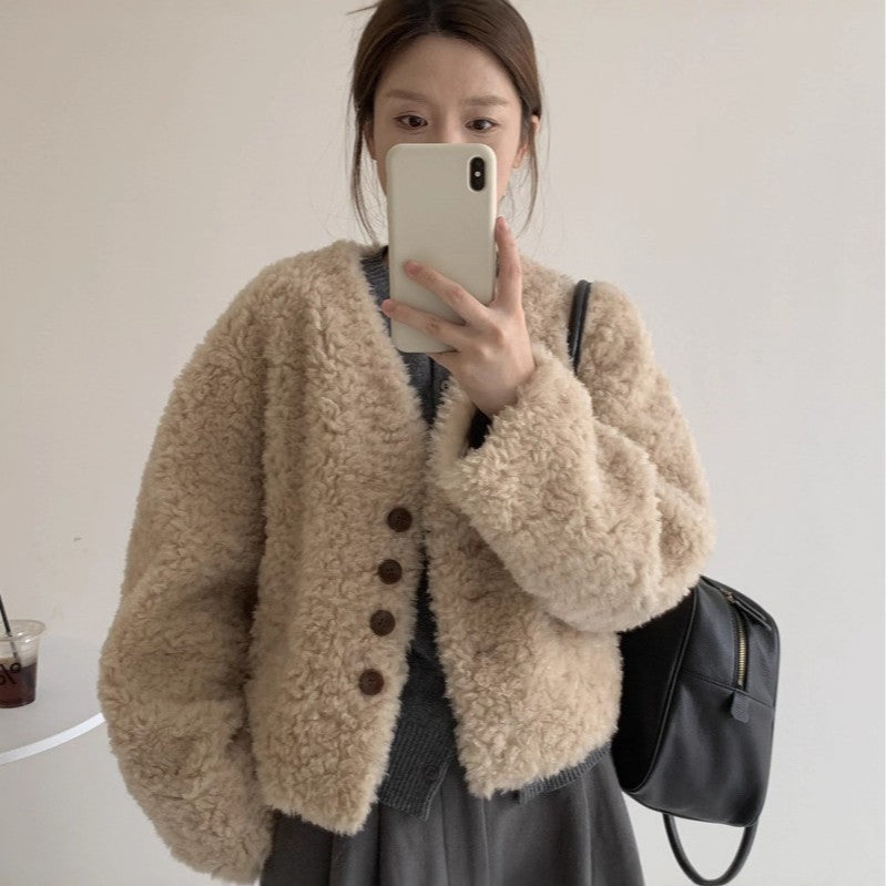 Women's V-neck short loose padded lambswool coat in a relaxed fit, shown from the front