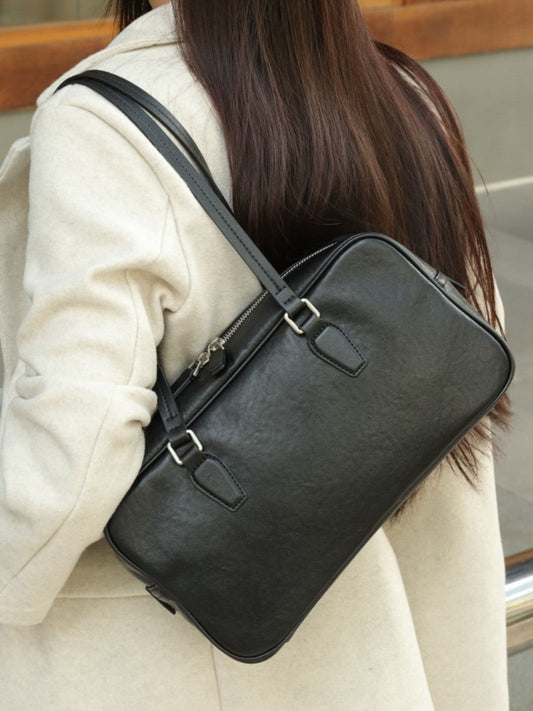 Women's cowhide leather armpit bowling tote handbag in a structured design