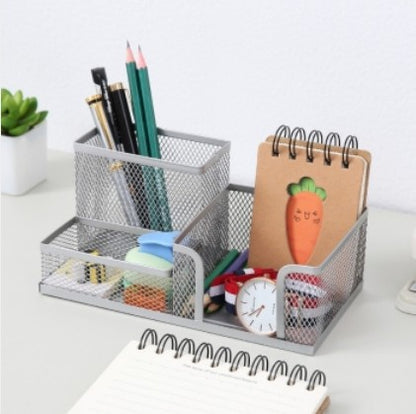 Creative metal four-grid pen holder for office use by BACKUPMYFILESNOW.COM®, featuring a sleek, durable design for organizing pens and stationery.