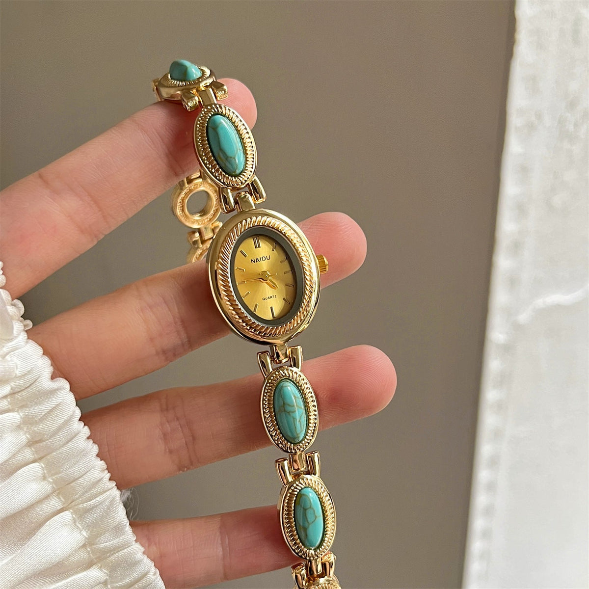 Women's agate bead bracelet watch with a round watch face and beaded band