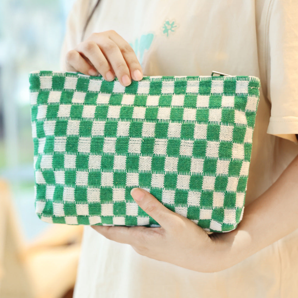 Large-capacity yarn checkerboard makeup bag with zip closure and spacious interior insidesealed content