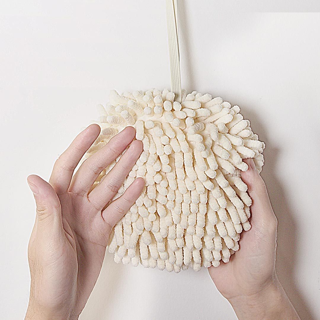 Hanging hand towel displayed for easy access, featuring a soft textured fabric design