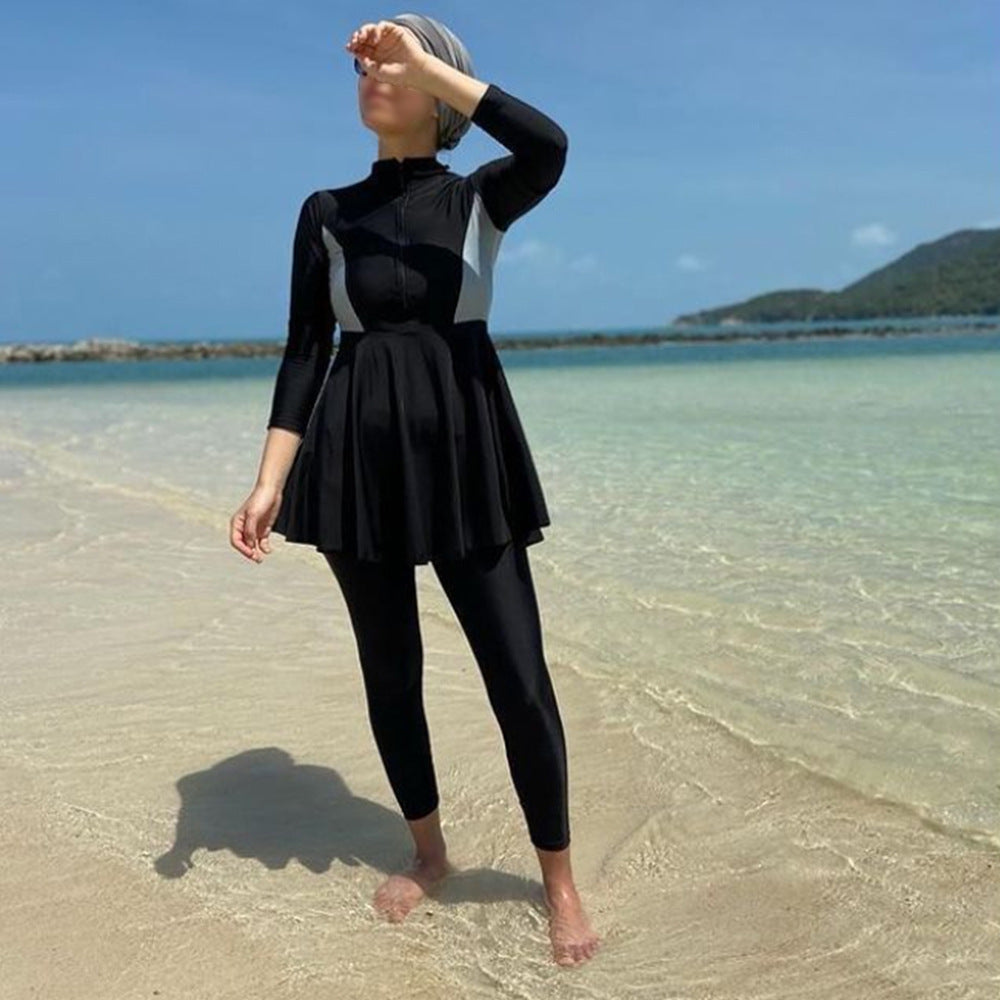 Muslim women's three-piece conservative swimsuit with long-sleeve top, pants, and swim hijab