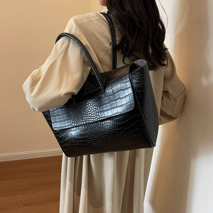 Stone pattern large capacity handbag in a structured design with spacious interior.
