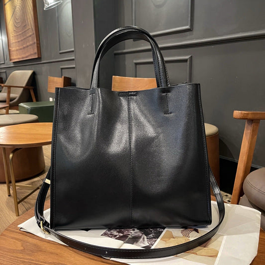 Commute cowhide leather tote bag, large single-shoulder bucket bag for women in a simple versatile design