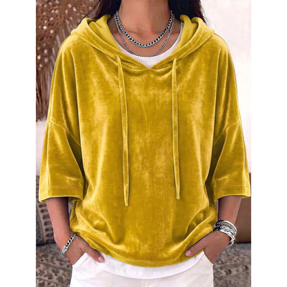 Solid-color velvet hoodie with drawstring and three-quarter sleeves.