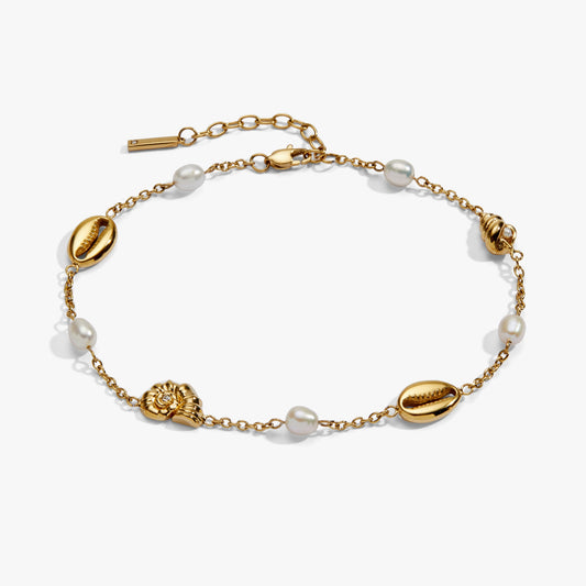 Gold stainless steel anklet with seashell and pearl inline charms, stylish and delicate jewelry by ALEX AND ANI.