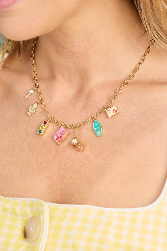 Gold Road Trip Multi-Charm Necklace by ALEX AND ANI showing layered charms and travel-themed pendants on a chain.