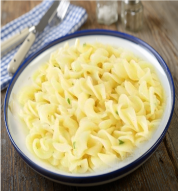 Creamy Alfredo pasta from AmBari Nutrition with a rich cheese sauce and tender pasta in a close-up view.