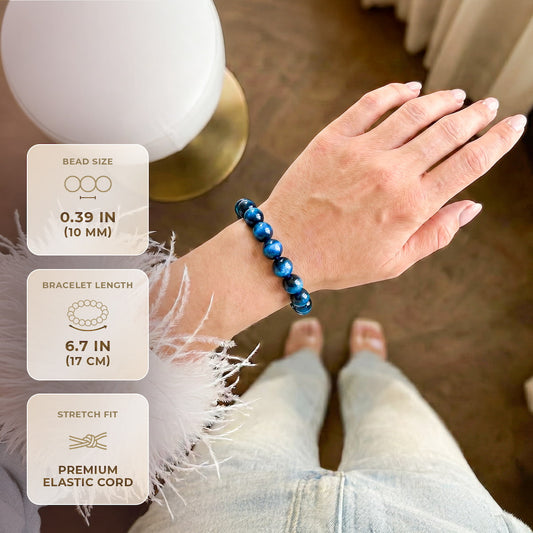 Royal blue Tiger’s Eye bracelet from Conscious Items, featuring polished beads with a sleek, adjustable design.
