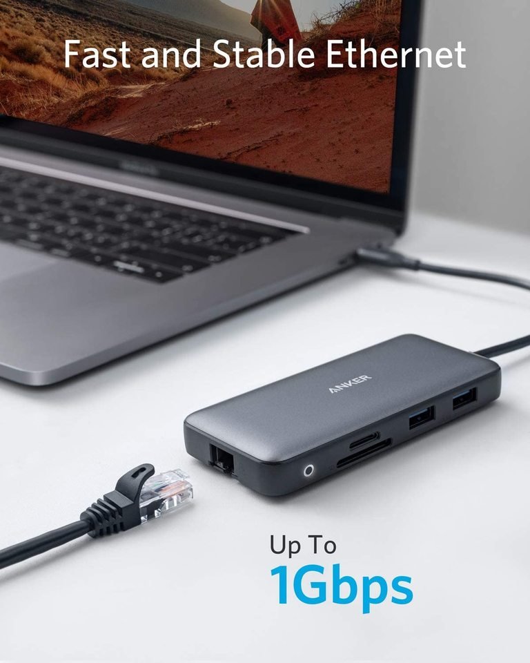 Anker 553 USB-C Hub in black showing multiple ports for charging and connectivity in a sleek design.