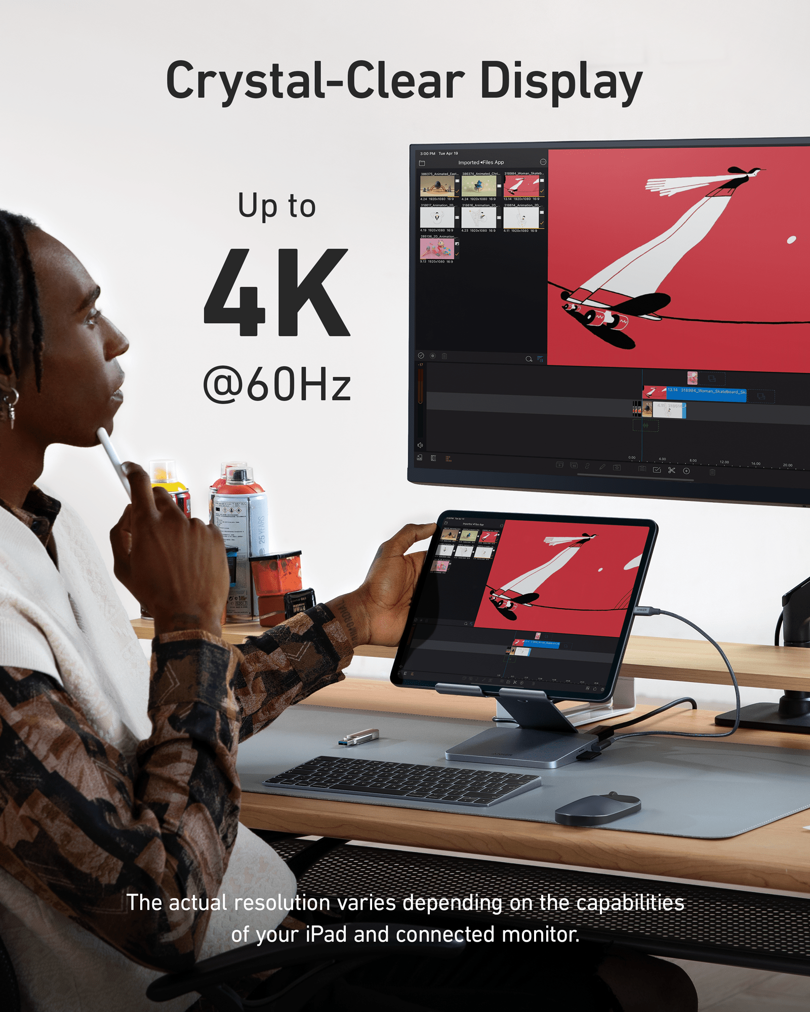 Anker 551 USB-C Hub in gray with 8-in-1 ports, designed for charging and tablet stand functionality, shown with connected devices