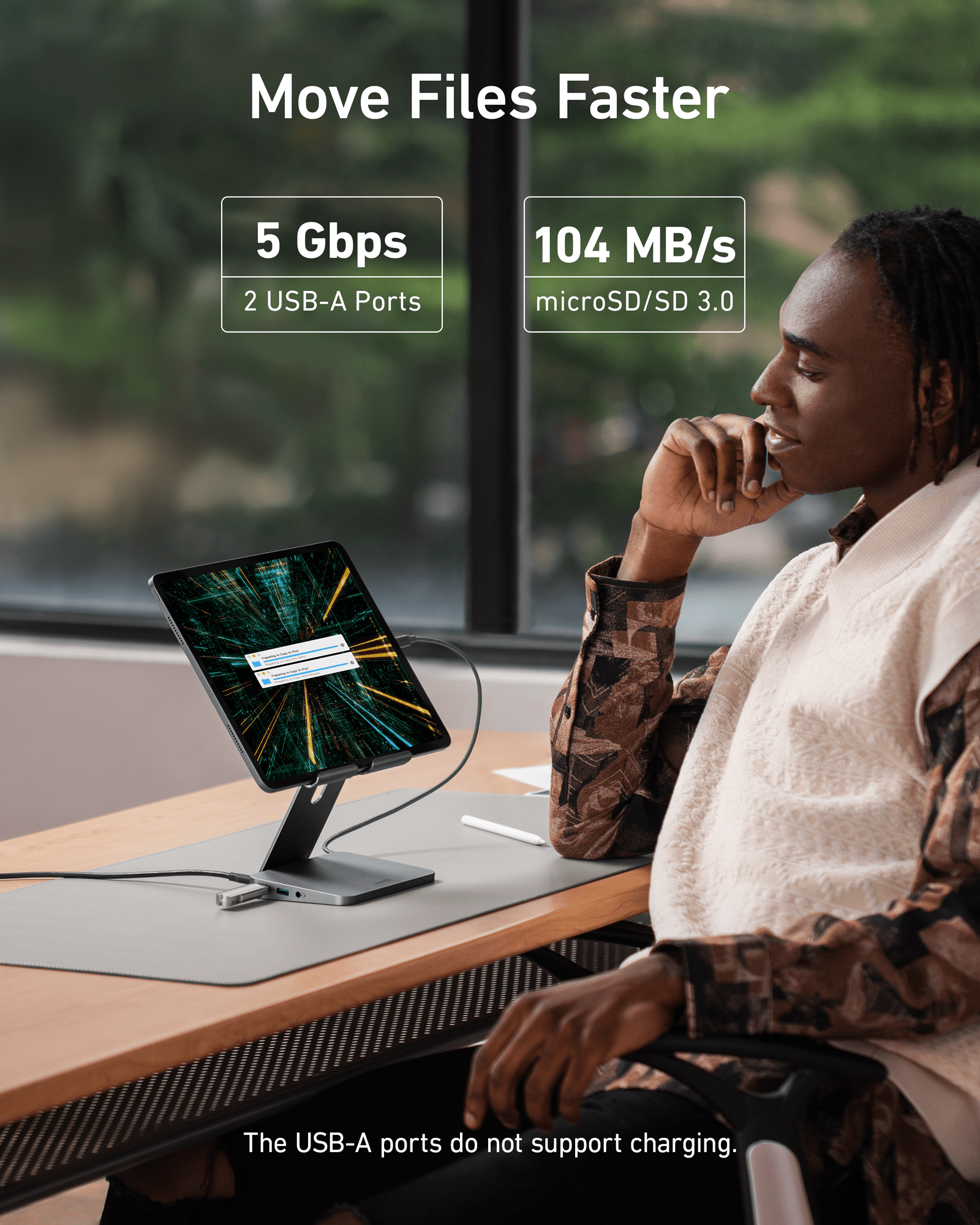 Anker 551 USB-C Hub in gray showing multiple ports and tablet stand for charging and connectivity.