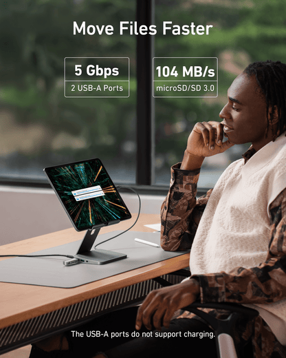 Anker 551 USB-C Hub in gray showing multiple ports and tablet stand for charging and connectivity.