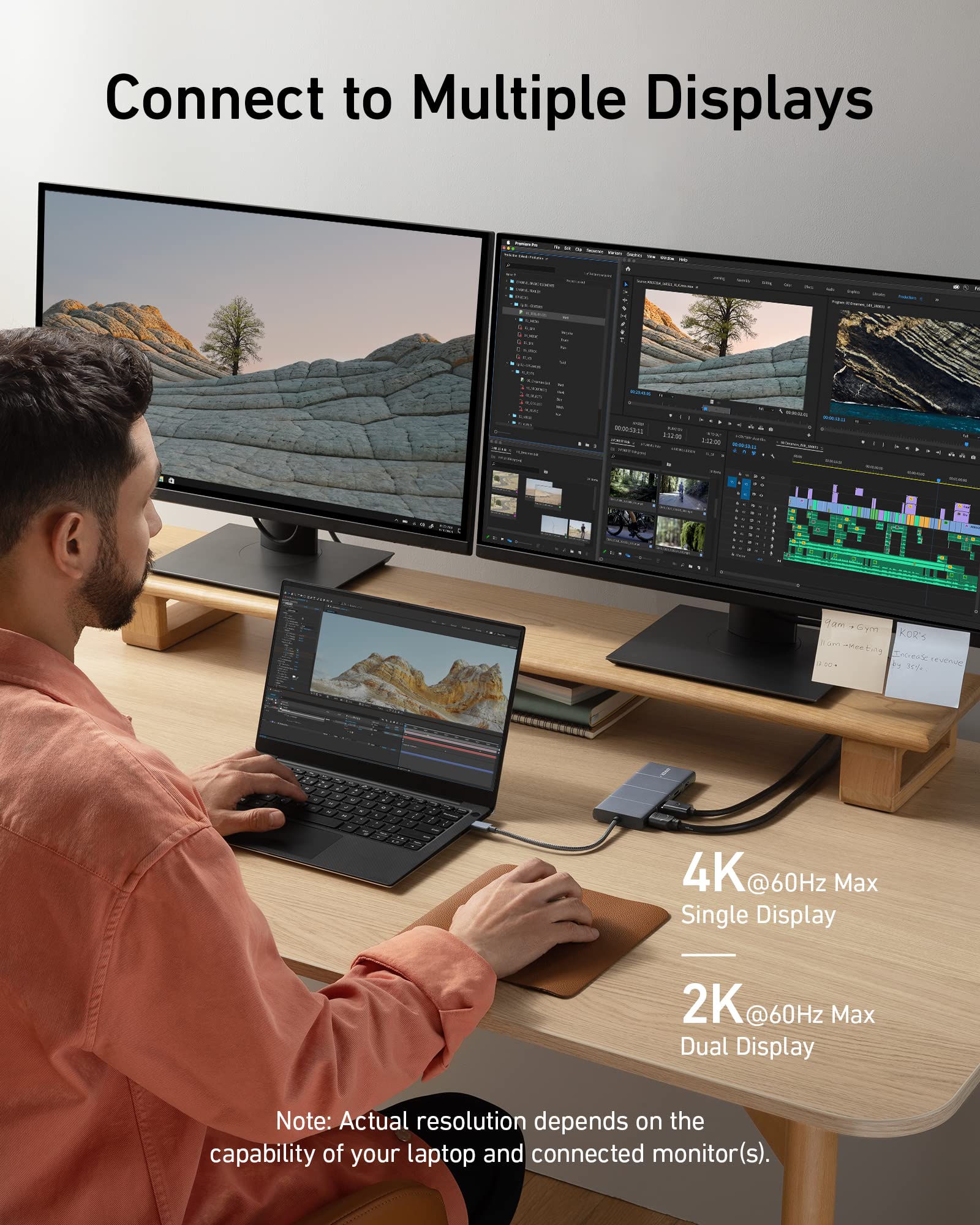 Anker 565 USB-C Hub in grey showing multiple ports for charging and connectivity on a sleek electronic device.